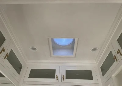 Newly plastered walk-in closet with skylight