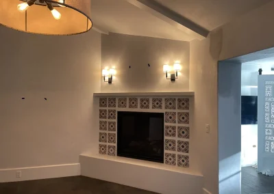 Newly plastered family room with fireplace